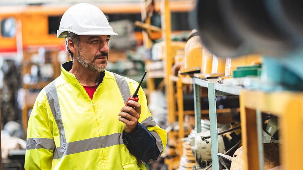 calibration technician with a walkie talkie