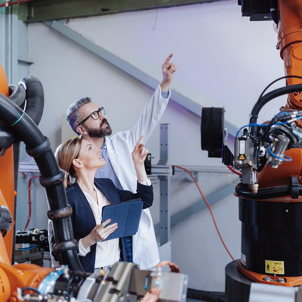 two calibration technicians observing equipment
